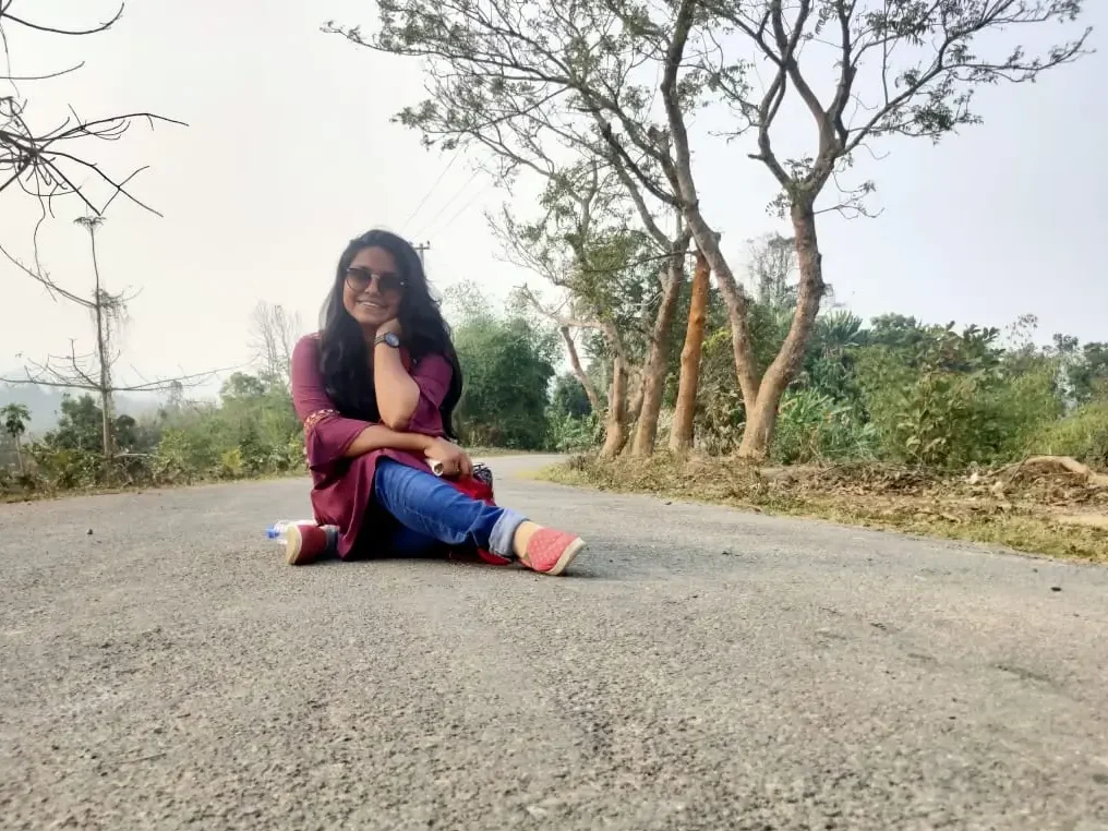 Biplobi sitting on the road